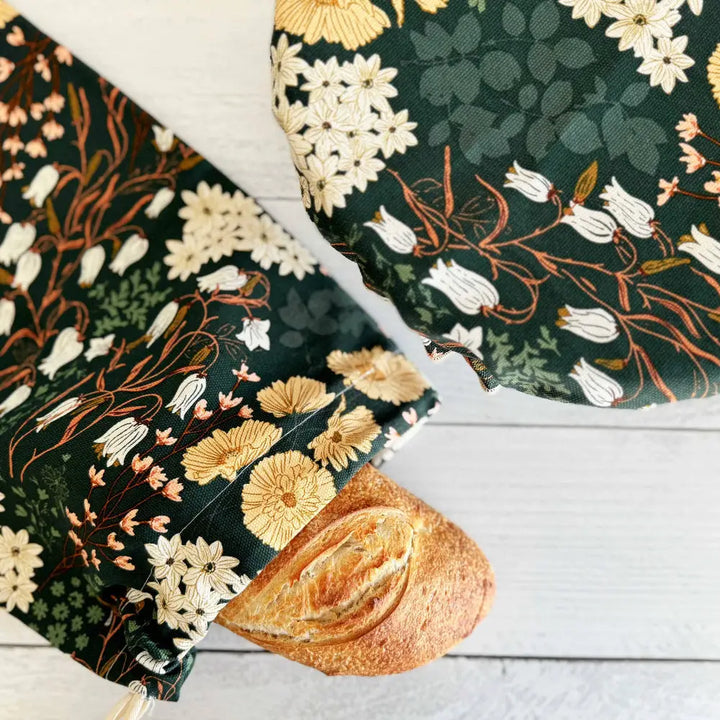 Floral-patterned reusable bread bag in the Bread Makers Set with fresh loaf inside