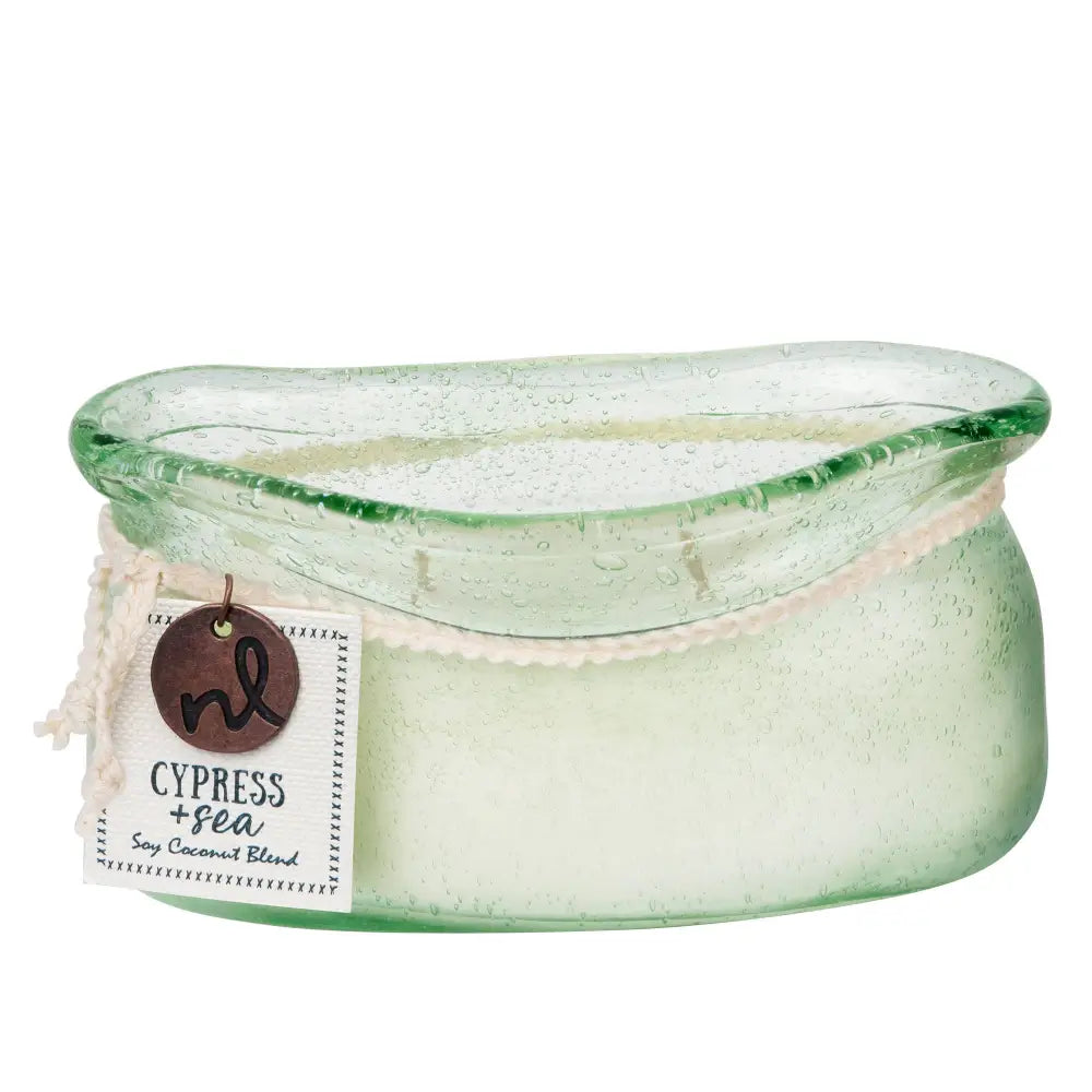 A translucent green bubble glass candle vessel with a textured bubbly surface and white wax inside from the candle collection