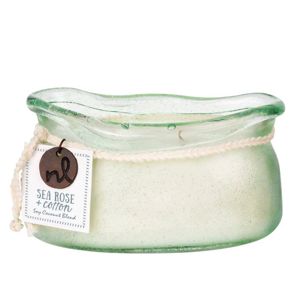 Translucent green bubble glass candle from bubble glass candle collection with wavy rim and creamy soy coconut wax