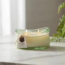 Sea rose and cotton bubble glass candle with lit wicks