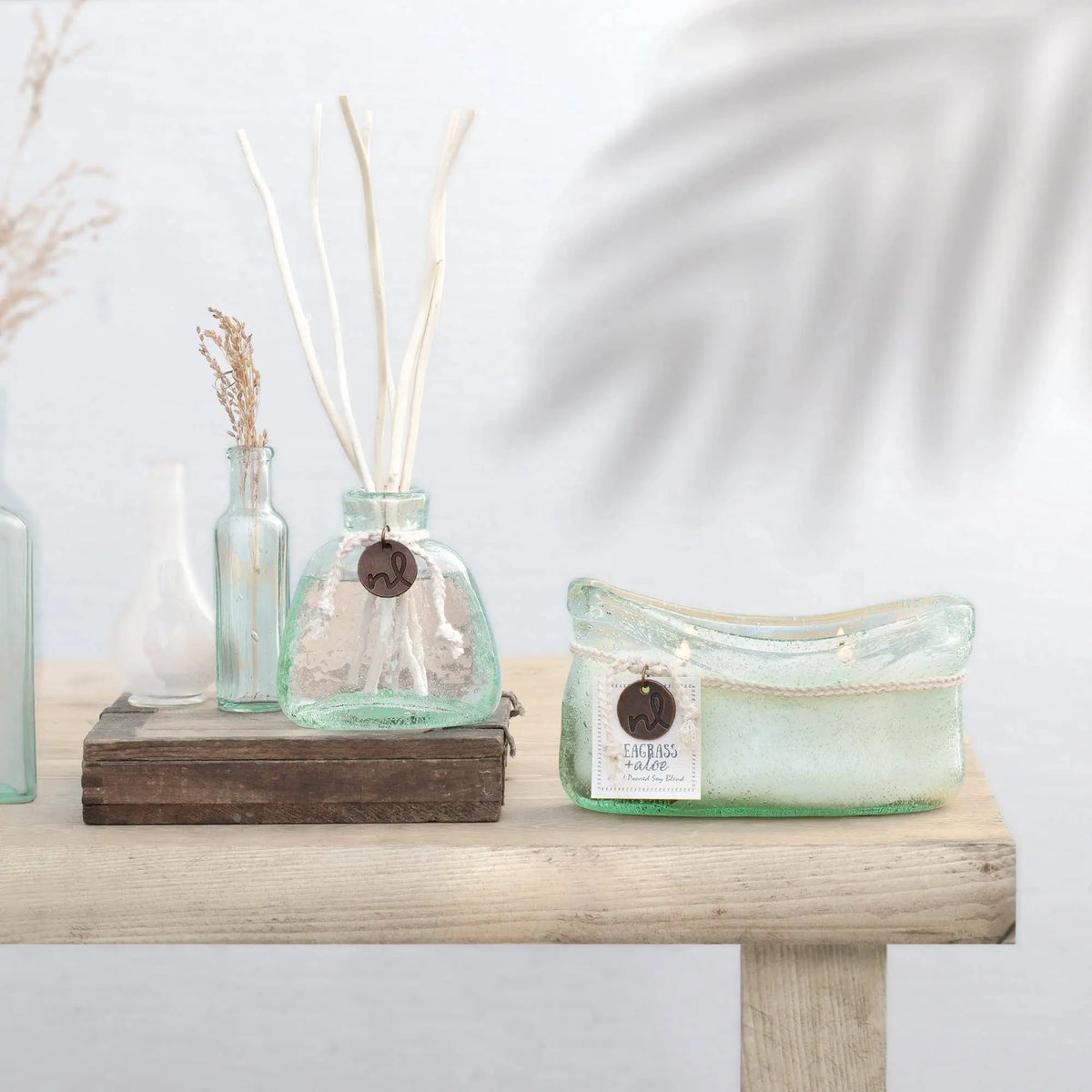 Handmade seafoam green glass candle with sea rose sea salt scent
