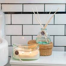 Handmade Windward reed diffuser with sea rose sea salt scent in translucent green glass