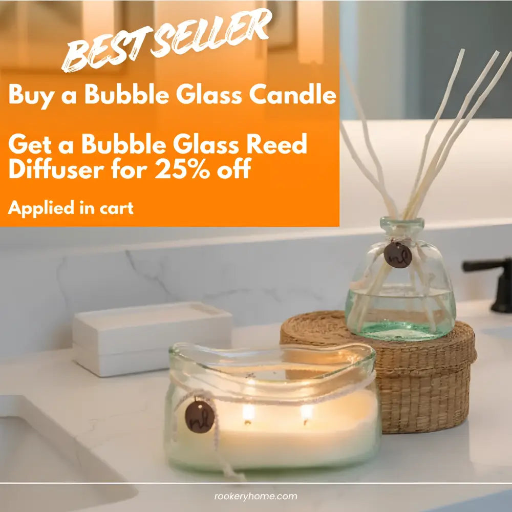 Lit bubble glass candle with white wax and charm in Bubble Glass Reed Diffuser