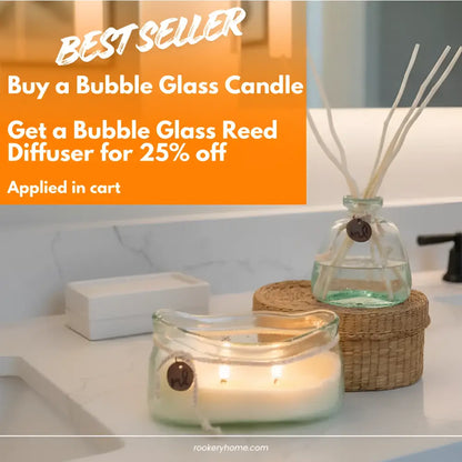 Lit bubble glass candle with white wax and charm in Bubble Glass Reed Diffuser