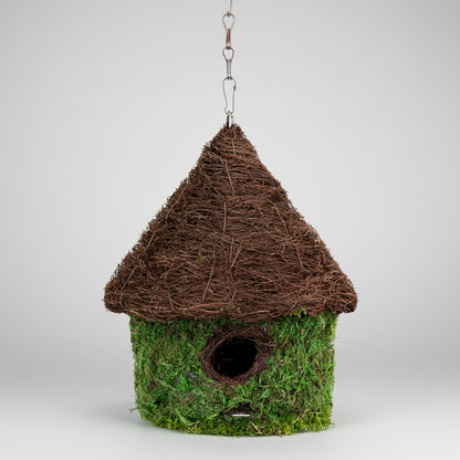 Charming bungalow woven birdhouse in fresh green with moss and thatched roof