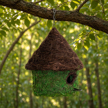 A charming woven sanctuary bungalow birdhouse in green and brown vine and moss to invite backyard birds weather tested