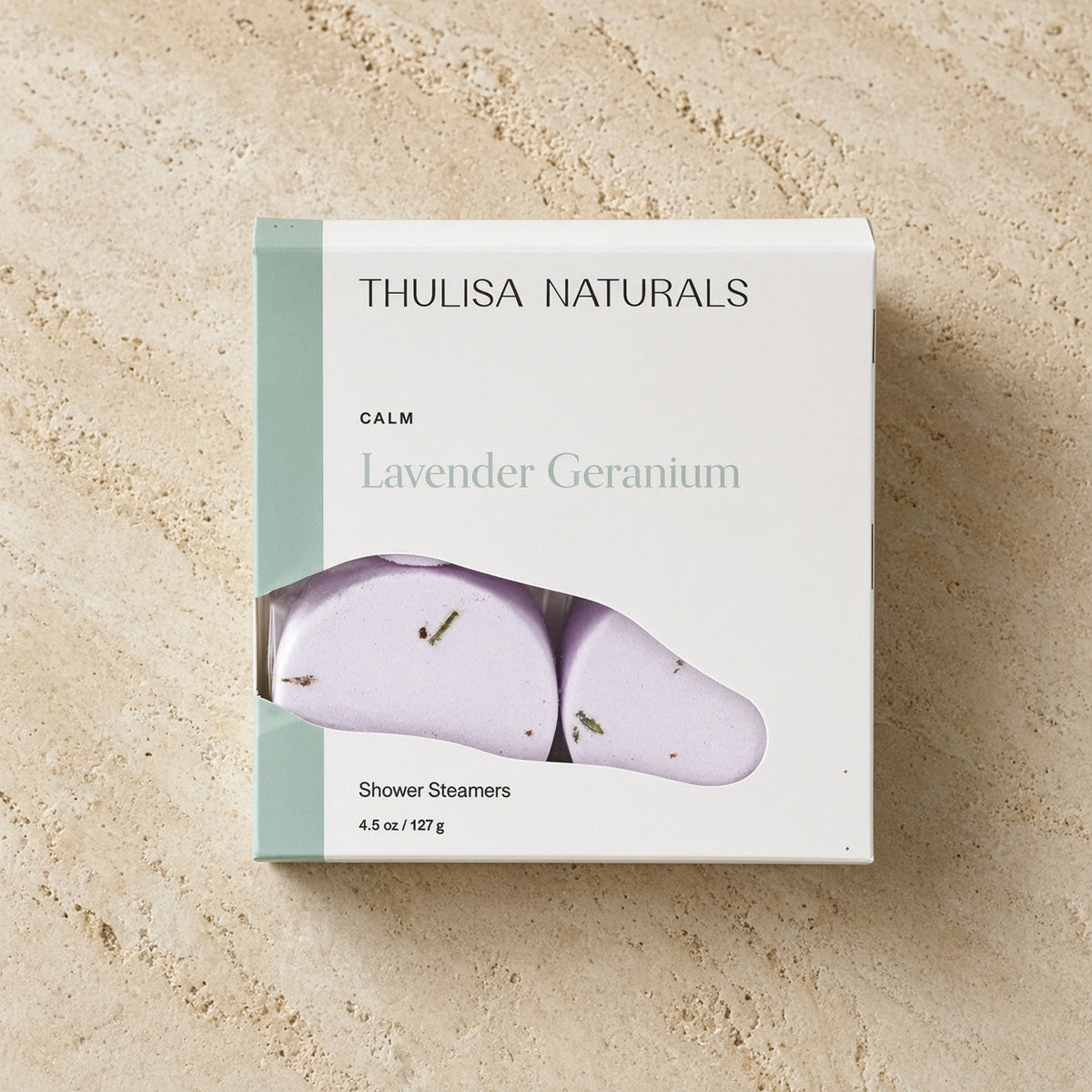 Calm shower steamers lavender-geranium 4-pack in sleek white and sage green box with natural ingredients by thulisa naturals