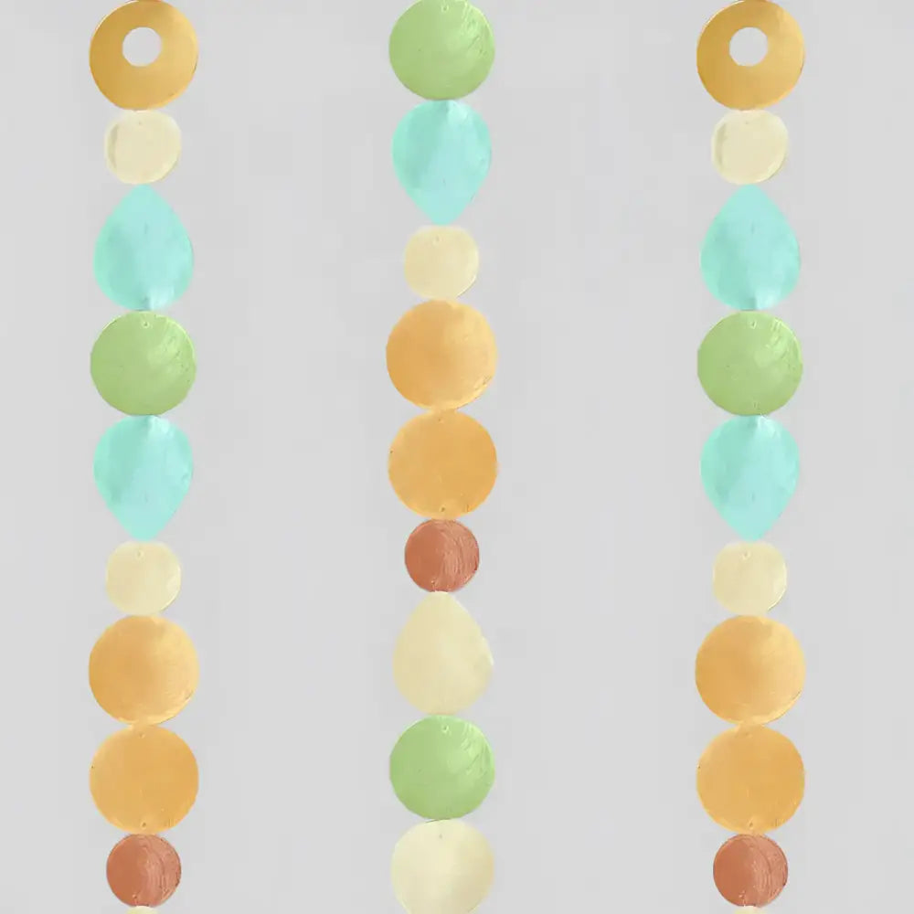 Pastel capiz strand garland in orange blue and green with round and teardrop beads lets you watch light dance beautifully