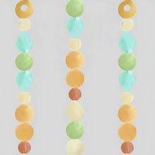 Pastel capiz strand garland in orange blue and green with round and teardrop beads lets you watch light dance beautifully
