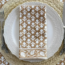 Folded tan and white floral cotton block print napkin from Caramel Block Print Napkin set