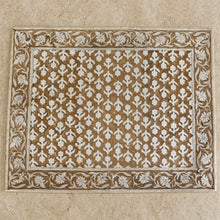 Rectangular beige and white carved wooden block print placemat with intricate floral patterns for table decor