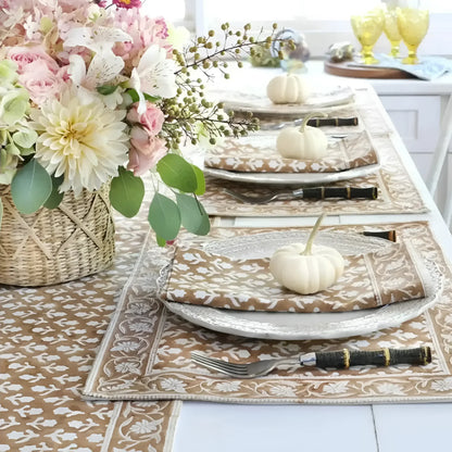 Caramel block print placemat set with floral centerpiece and autumn-themed table setup