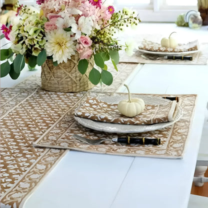 Caramel block print placemat set with floral centerpiece and pumpkins for stylish dining