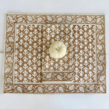 Brown and white caramel block print placemat and napkin set with small white pumpkin
