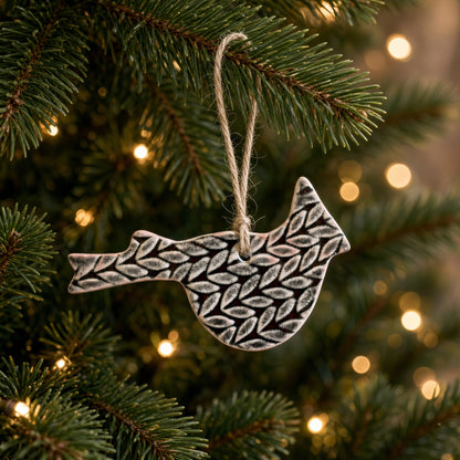 Cardinal ceramic ornament with adorable cardinal ornament design in matte white and beautifully imprinted pattern hanging from natural twine for holiday décor