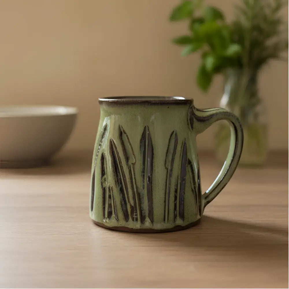 Handmade pottery carved cattail sage green textured mug