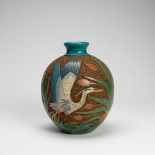 Carved Clay Heron Vase with textured clay beneath, blue heron design, teal neck