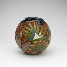 Decorated carved clay turtle vase with dark opening, perfect to celebrate ocean vibes