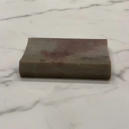 Carved soapstone rectangle concave soap dish with polished greenish brown hues and subtle reddish patches perfect as a tile soap dish
