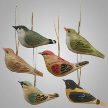 Six carved wood bird ornaments hanging, perfect for rustic decor or gifts