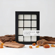 Black-framed box of twelve white soy wax melts labeled cedarwood amber by nectar republic for cozy scenting