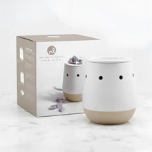 White and beige ceramic electric wax melt warmer with black vents perfect for favorite wax melts and a matte white warmer look