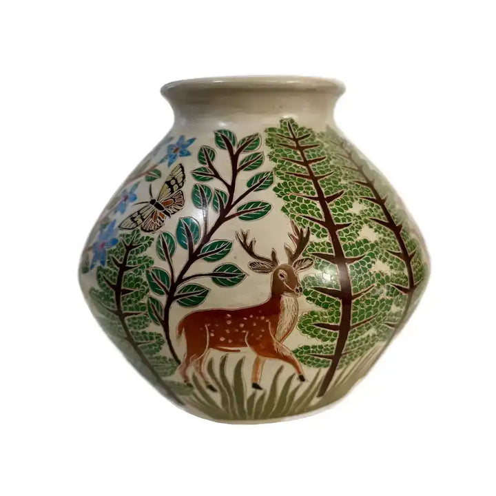 A carved ceramic vase featuring a woodlands habitat against a white background.