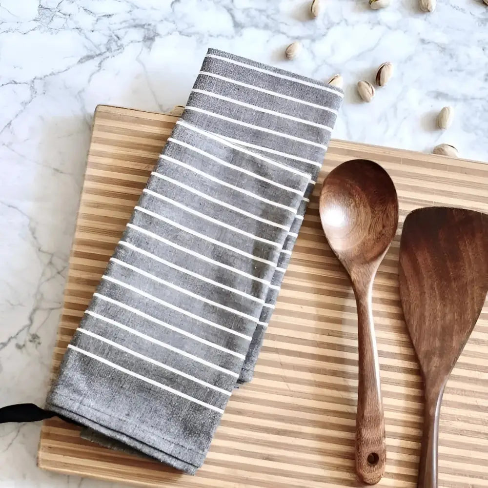 Gray striped organic cotton tea towel set with wooden spoon, spatula on cutting board