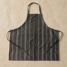 Charcoal gray full-length cooking apron with thin white stripes and classic design perfect for summer bbqs and cooking attire
