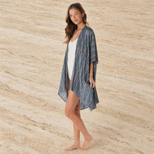 A loose fit charcoal tribal print kimono cover-up in dark blue and white with a breezy rayon drape