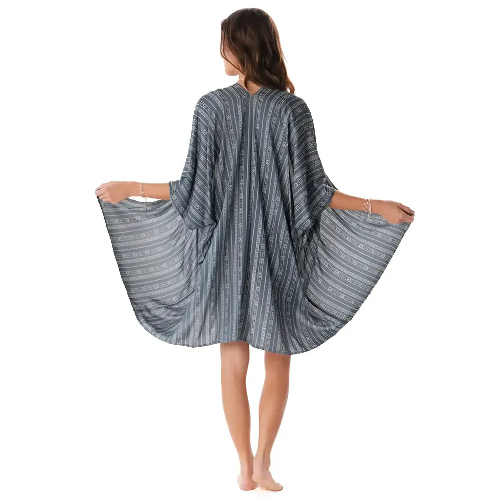 A flowing charcoal tribal print kimono cover-up with dark gray and white stripes and loose wide sleeves