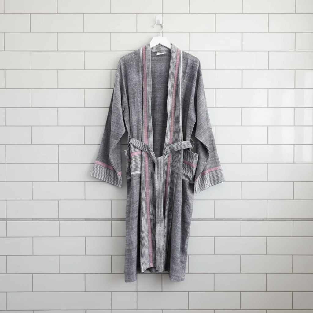 Gray and pink striped Charcoal Tribeca Long Bathrobe hanging on a white hook