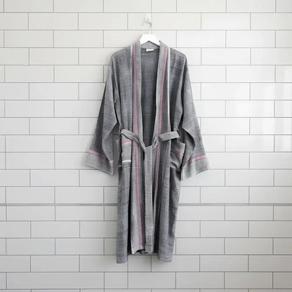 A soft gray bathrobe with ruby striped turkish towel colors, ribbed cuffs, and matching belt made of turkish cotton