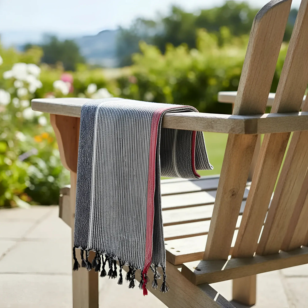 Charcoal white and ruby striped turkish cotton towel with gray white stripes red border and black tassels