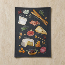 Black chalkboard style charcuterie tea towel with detailed cheese meat fruit art and hanging loop perfect hostess gift