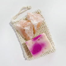 Pink passion fruit soap bar in woven bag with salt crystals for body scrub