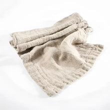 textured linen table runner with neutral background.