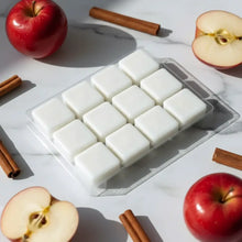 White square cinnamon spiced apples coconut-soy wax melts neatly arranged in a clear plastic tray