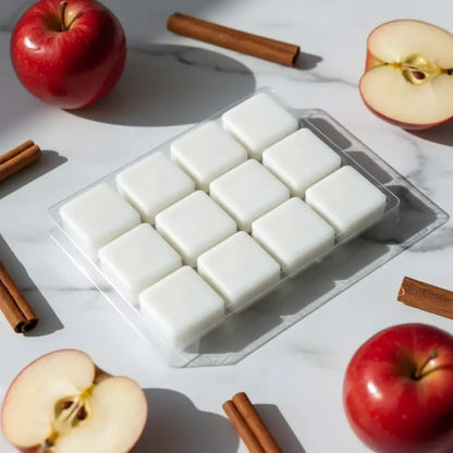 White square cinnamon spiced apples coconut-soy wax melts neatly arranged in a clear plastic tray