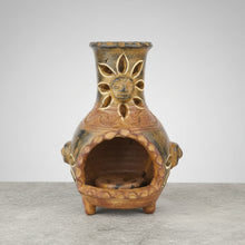 Hand-painted terracotta sun pot with gold accents in three garden colors