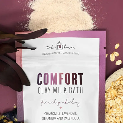 A white pouch of take haven comfort clay milk bath with french pink clay chamomile lavender geranium and calendula