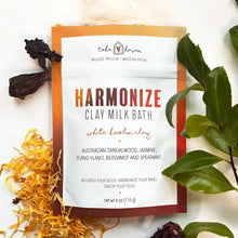 Take haven harmonize clay milk bath soak pouch with australian sandalwood and ylang ylang surrounded by colorful leaves