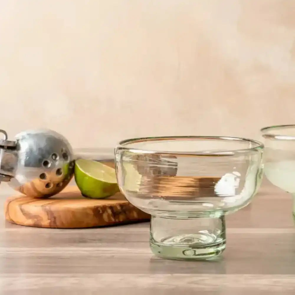 Margarita / Mezcal Tasting Glasses on table next to wooden cutting board with lime on it