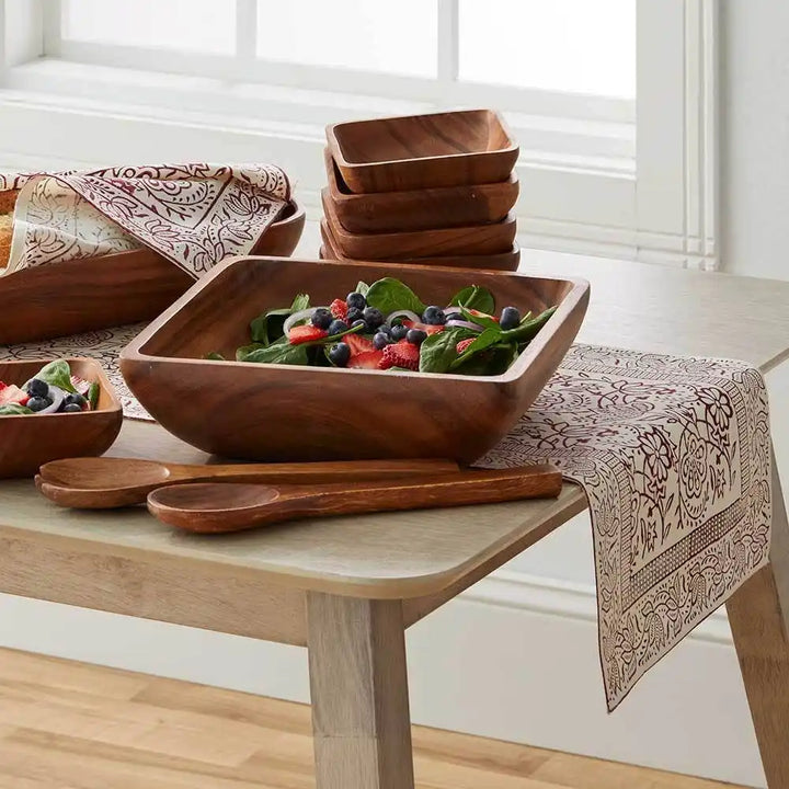 Cranberry Vine Block Print Table Runner on a table with a bowl of salad and wooden serving bowls
