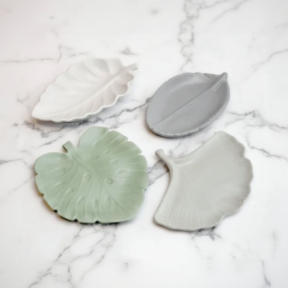 Handmade concrete leaf tray with four eco-friendly leaf-shaped trinket dishes in white, gray, and light green