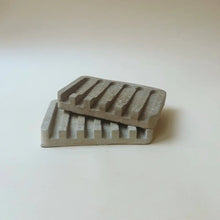 Hand poured concrete and botanical powders soap dishes in brown or gray.