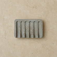 Gray hand poured concrete soap tray with vertical ridges perfect as a durable concrete tray for soap storage