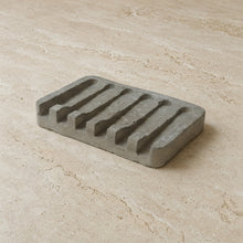 Gray concrete soap tray with five rectangular slots made from hand poured concrete for bathroom use