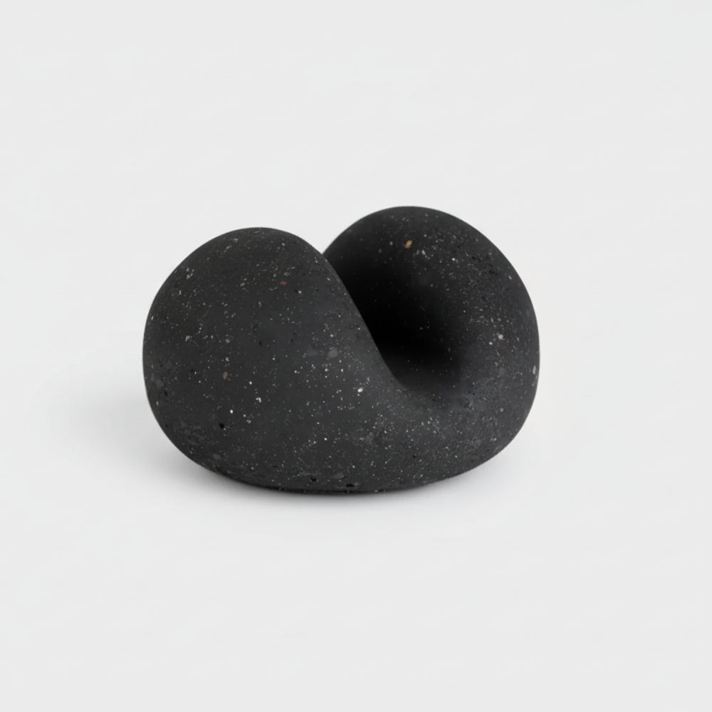 Handmade eco-friendly concrete sponge holder with black speckled twisted form