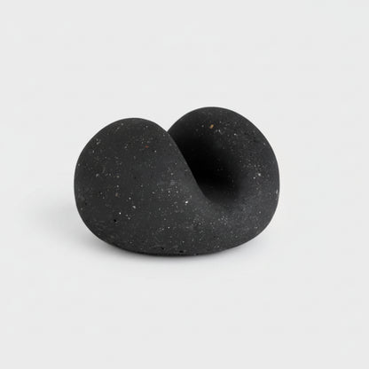 Handmade eco-friendly concrete sponge holder with black speckled twisted form